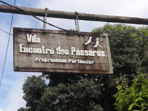 Et logo, certifikat, skilt eller en pris der bliver vist frem på Casa 497 Itacare