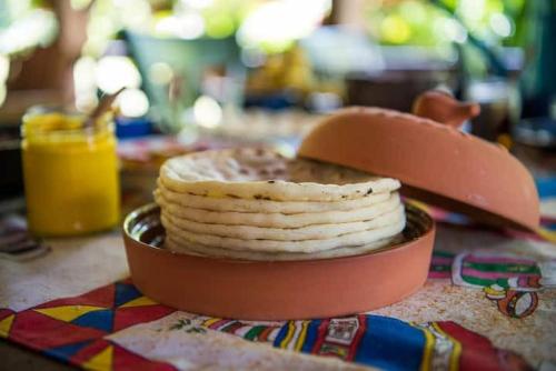 a plate of crackers sitting on a table at Finca Anjala - Architectural lodge on sustainable in Ojochal