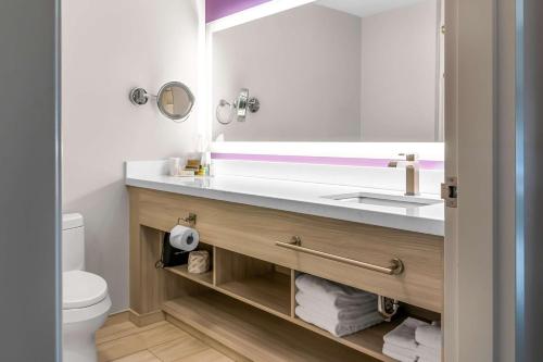 a bathroom with a sink and a toilet at Best Western Premier Winnipeg East in Winnipeg