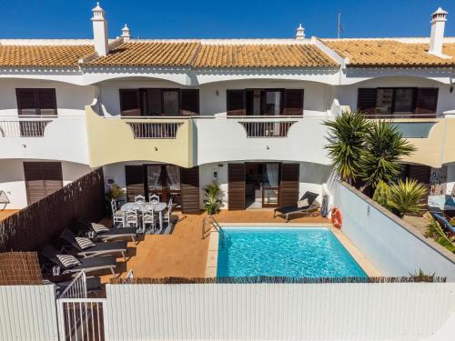 an aerial view of a house with a swimming pool at Villa Canto II - 500m from the Beach - Private Swimming Pool - Wi Fi in Guia