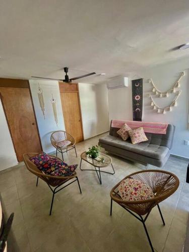 a living room with a couch and two chairs at Great condo in the best location in Puerto Vallarta
