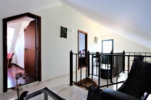 a living room with a staircase and a mirror at Haus Seixal in Seixal