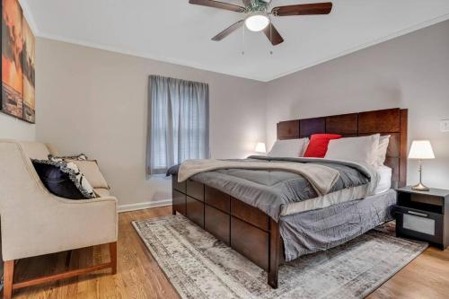 a bedroom with a bed and a ceiling fan at Charming 3-bedroom Home -Quiet East Atlanta Neighborhood in Atlanta