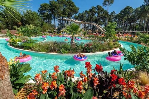 a group of people riding onlatable tubes in a water park at Villa in France with Private Garden in Salles