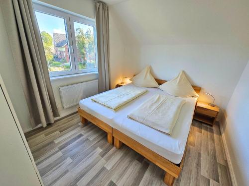 Una cama o camas en una habitación de Sechendorf-Ferienhaus-Solaengen-Sechendorf