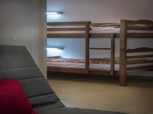 a living room with two bunk beds and a couch at Apartment in Les Eyzies near Font-de-Gaume in Les Eyzies-de-Tayac