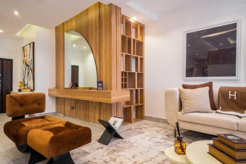 a living room with a couch and a chair at George Residence Banana Island Road, Ikoyi in Lagos