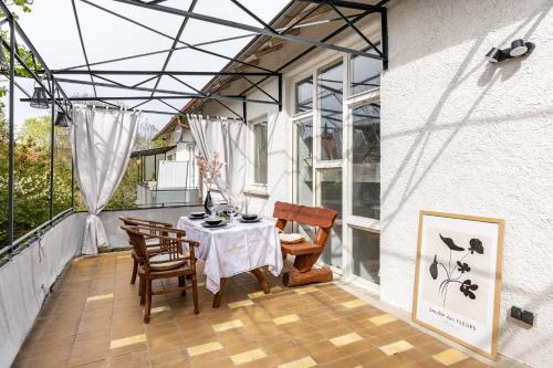 a patio with a table and chairs on a balcony at Apartment AlbGlück 2 Hechingen in Hechingen