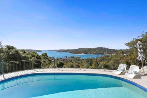 a swimming pool with a view of the water at Sea La Vie at Bayview - 'paradise by the sea' in Bay View