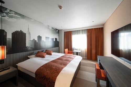 Postel nebo postele na pokoji v ubytování Kojima Puchi Hotel