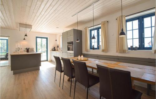 a kitchen and dining room with a table and chairs at Awesome Home In Otterup With Wifi in Otterup