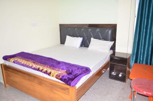 Postel nebo postele na pokoji v ubytování Hotel AV Priya