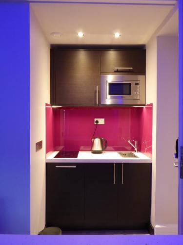 Кухня или мини-кухня в Court Residence Aparthotel
