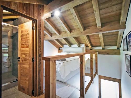 a room with wooden walls and a ceiling with beams at Chalet rénové avec sauna, salle de sport et navette gratuite - FR-1-613B-50 in Saint-Martin-de-Belleville