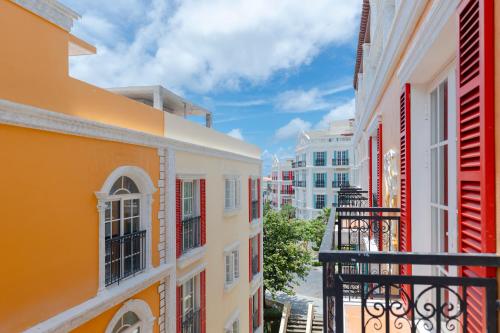 a view from a balcony of colorful buildings at HALA Home Phú Quốc in Phu Quoc