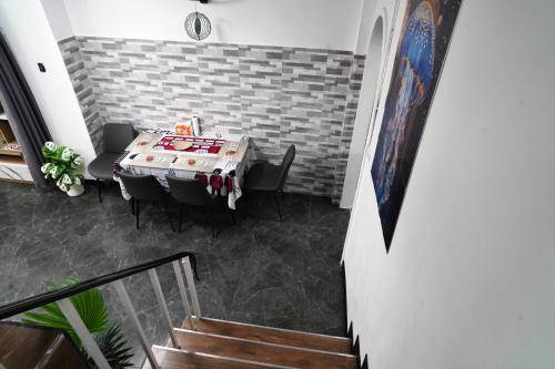 a dining room with a table and chairs at London House Phuket in Kata Beach