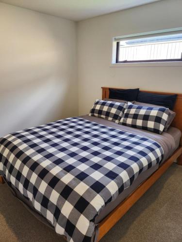 Postel nebo postele na pokoji v ubytování RemarkableStay
