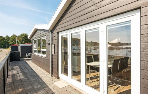 a house with sliding glass doors on a patio at Lovely Home In Haderslev With Wifi in Haderslev