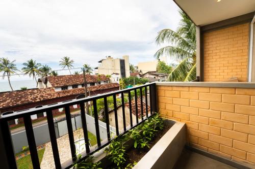 a balcony with a view of the ocean at Bliss Blessings Villa & Spa - Hikkaduwa in Hikkaduwa