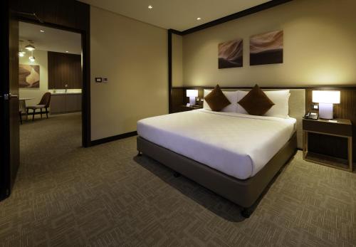 Ένα ή περισσότερα κρεβάτια σε δωμάτιο στο Grand Summit Hotel General Santos