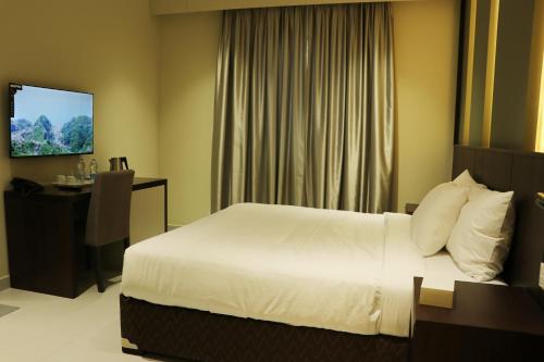 TV a/nebo společenská místnost v ubytování Jarzez Hotel Apartments Al Hail