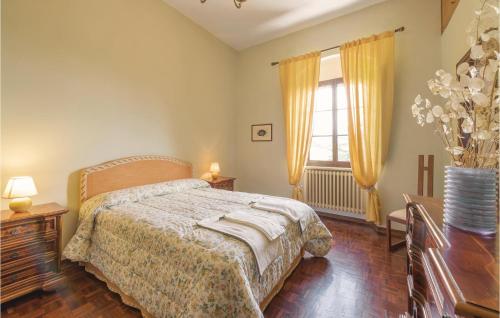 a bedroom with a bed and a large window at Rosavita in Chianni