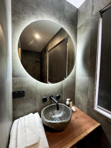 a bathroom with a sink and a mirror at Stanthorpe Holiday Park in Severnlea