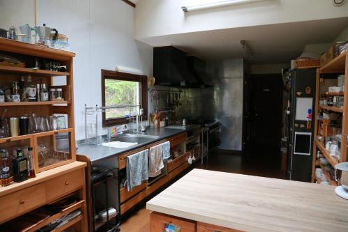 a kitchen with a sink and a counter top at ゲストハウスCoteau in Biei