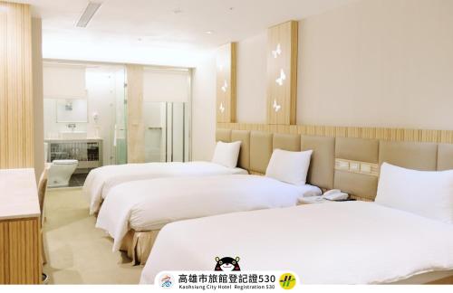 友愛京賞國際大飯店 Yoai Jing Shang Hotelにあるベッド