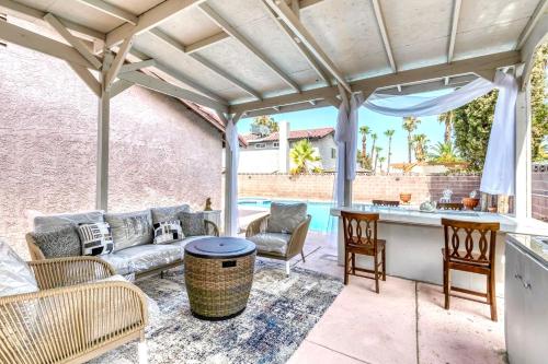 a patio with a couch and a table at Vacation Home in Vegas w Pool 2 mile to Strip in Las Vegas