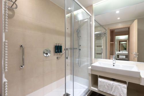 a bathroom with a sink and a shower at Hilton Garden Inn Venice Mestre in Mestre