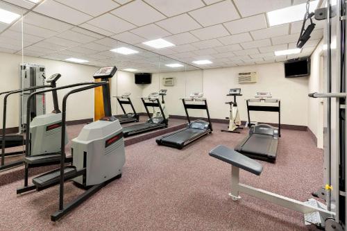 a gym with treadmills and machines in a room at Comfort Inn Somerset in Somerset