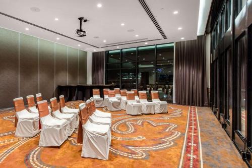 a conference room with a table and chairs in it at Cambria Hotel Nashville Downtown in Nashville