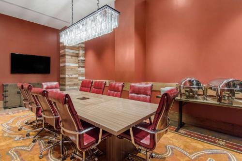a conference room with a table and chairs at Cambria Hotel Nashville Downtown in Nashville