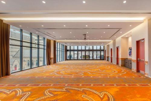 a large room with a large carpet on the floor at Cambria Hotel Nashville Downtown in Nashville