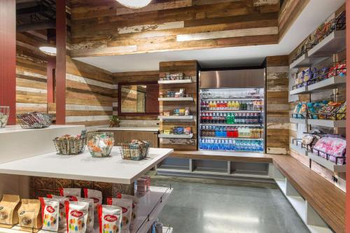 a grocery store aisle with a large refrigerator at Cambria Hotel Nashville Downtown in Nashville