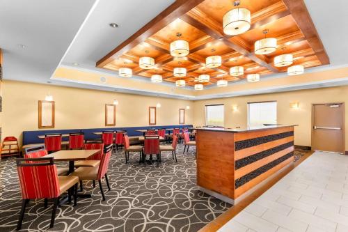 a large dining room with tables and chairs at Comfort Suites at Katy Mills in Katy