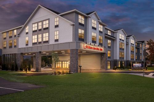 a building with a sign on the front of it at Hilton Garden Inn North Conway in North Conway