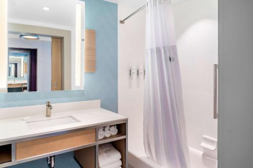 a bathroom with a sink and a shower at Hilton Garden Inn North Conway in North Conway