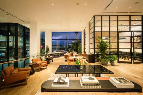 an open living room with a view of a building at Kimpton Everly Hotel Hollywood by IHG in Los Angeles