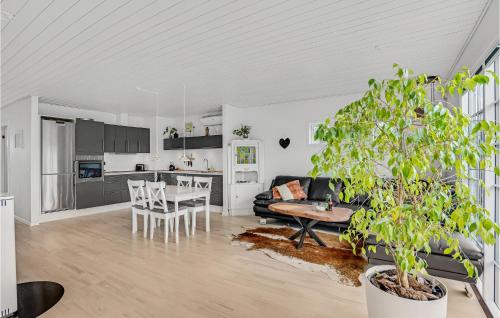 a living room with a couch and a table at Nice Home In Kirke Hyllinge With Wifi in Kirke-Hyllinge