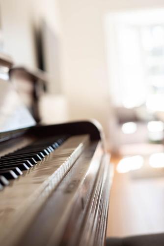 a close up of a piano keyboard at The Ranch-pool Table, Table Tennis, Firepit, Piano in Stanthorpe