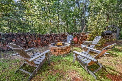 a group of chairs sitting around a fire pit at Honeysuckle Hill cabin in Sevierville