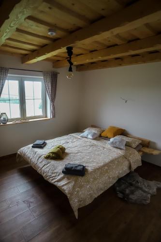 a bedroom with a large bed in a room at North Resorts Lucas in Novoť