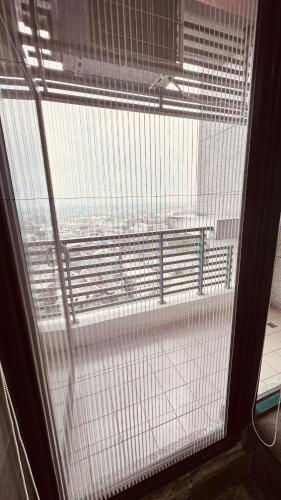 a window with a view of the outside of a building at 天天泡湯 in Yilan City