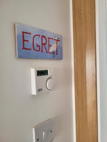 a sign on a wall with the word ect on it at The Boat House in Adrigole