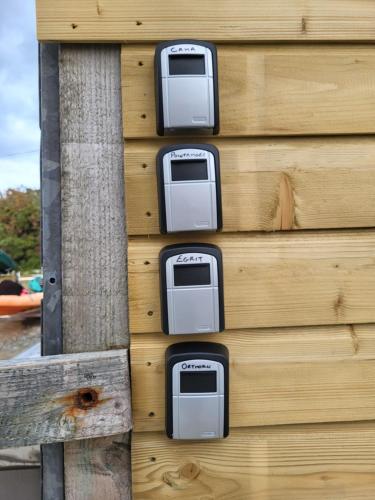 a wall with four toasters on the side of a building at The Boat House in Adrigole