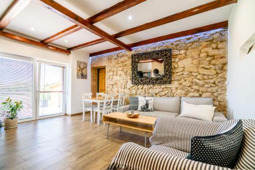 a living room with a couch and a table at Hacienda Napoli in Sebechleby