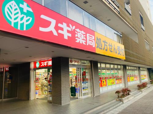 a store front of a building with signs on it at Meitetsu Inn Kariya in Kariya