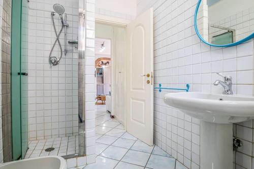 a bathroom with a sink and a shower at Villa Denise in Capoliveri